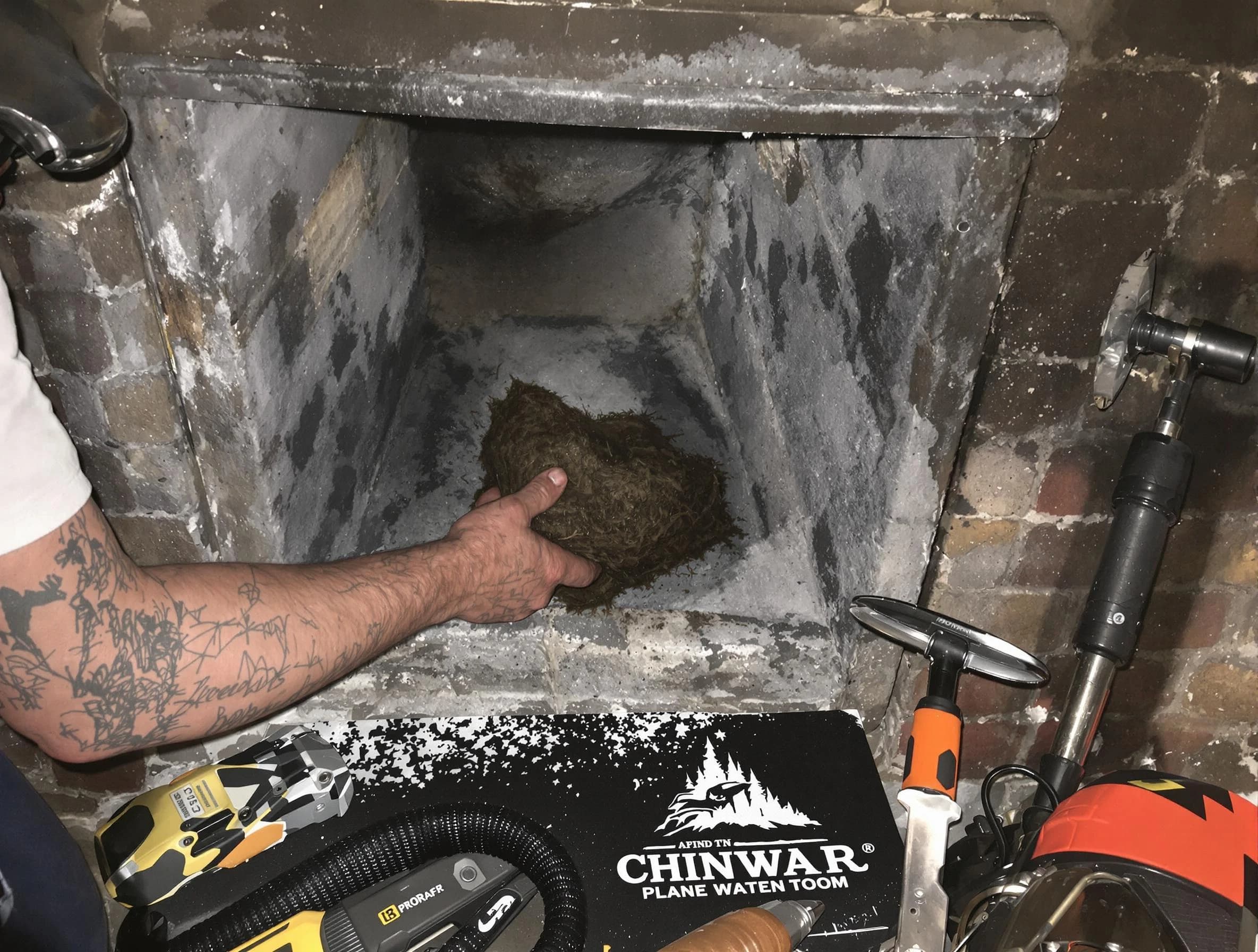 Greensburg Chimney Sweep safely removing debris and screening chimney in Greensburg, PA