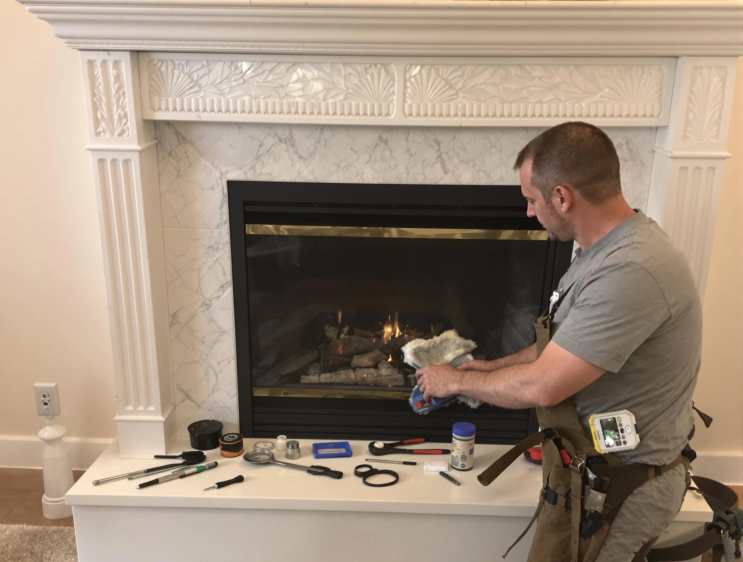Greensburg Chimney Sweep performing fireplace maintenance in Greensburg, PA